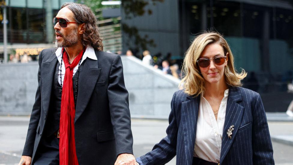 Russell Brand’s Wife Defends Him in Court as Rape Trial Continues