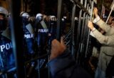 Poland Protesters Clash With Police Over Court Chief Suspension